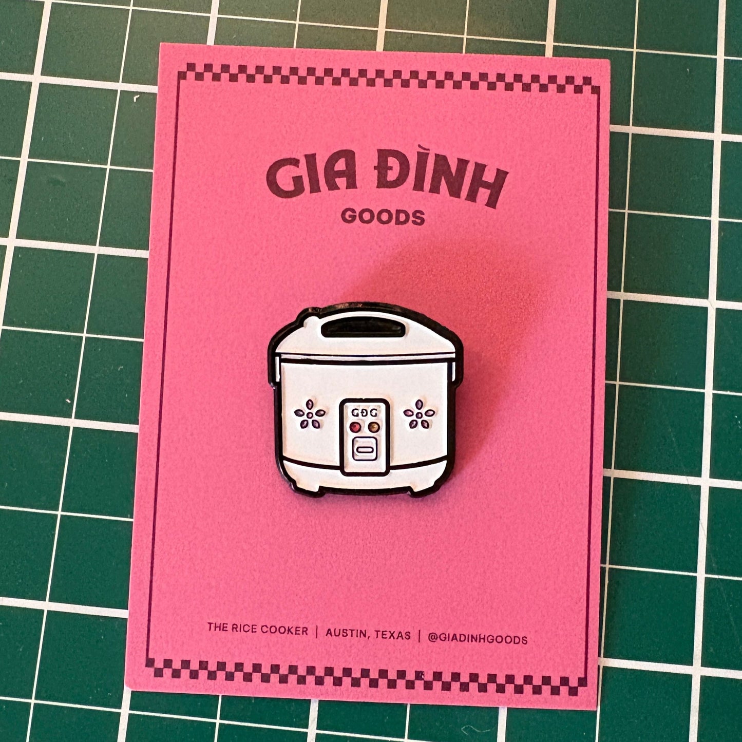 Gia Dinh Goods rice cooker pin on a pink backing card
