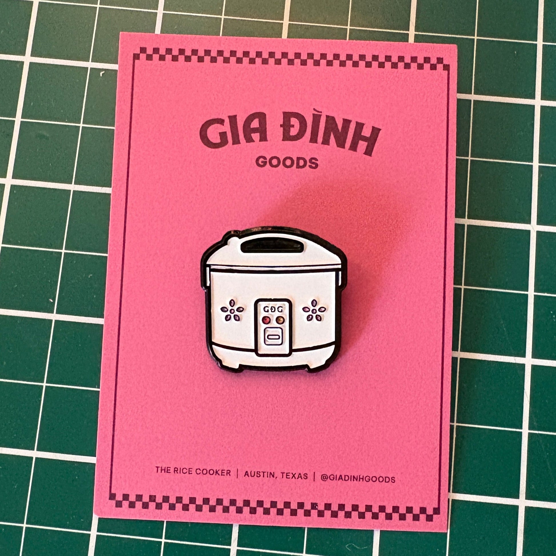 Gia Dinh Goods rice cooker pin on a pink backing card